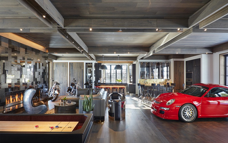 Garage with white cabinets and walls painted in earth tones