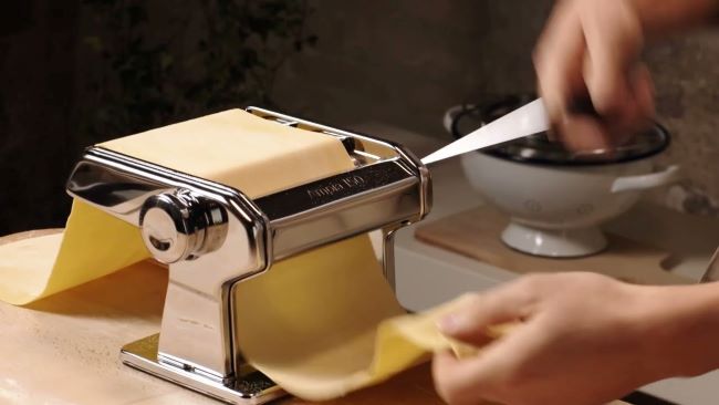 Homemade pasta being prepared using a Marcato pasta maker