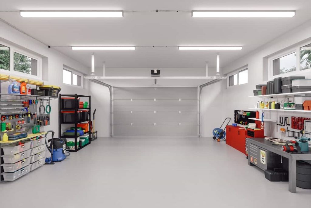 California garage transformation into a functional workspace with organized storage, shelving, and clean modern design